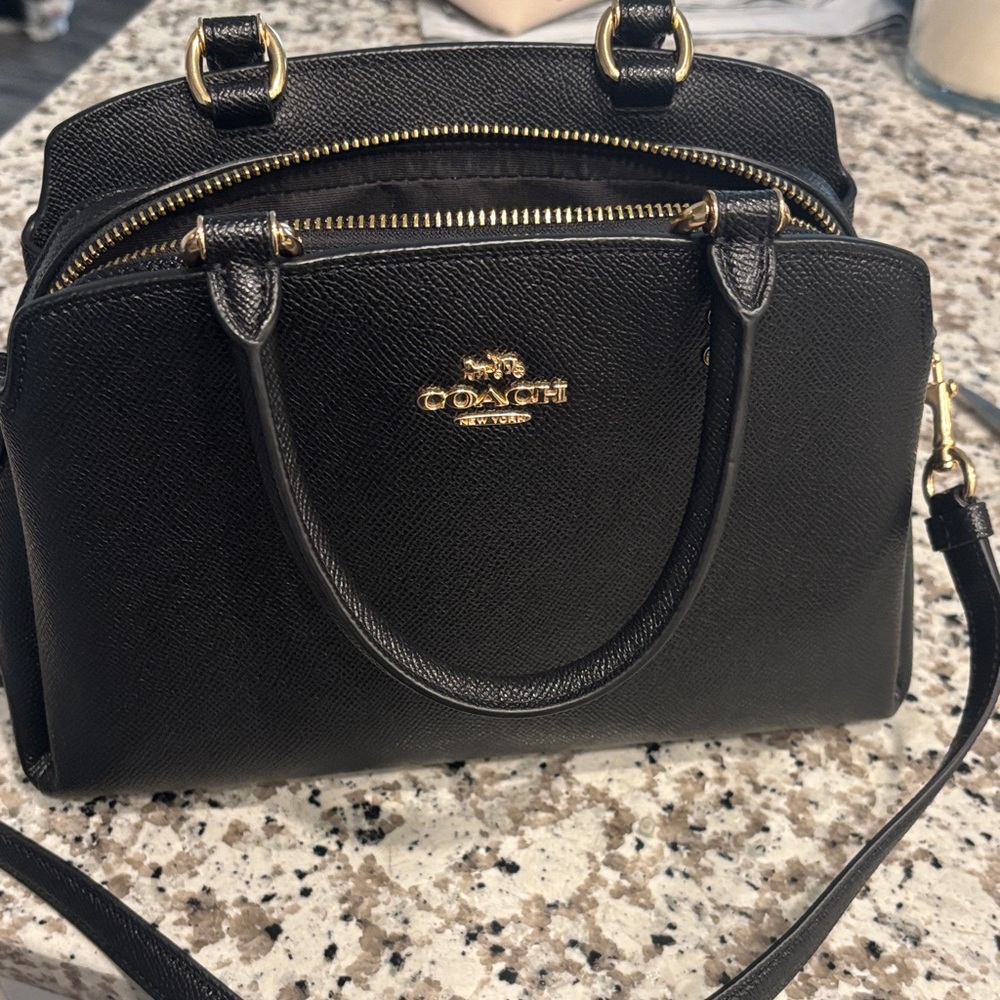 Coach Black Satchel with Gold Hardware and Structured Design